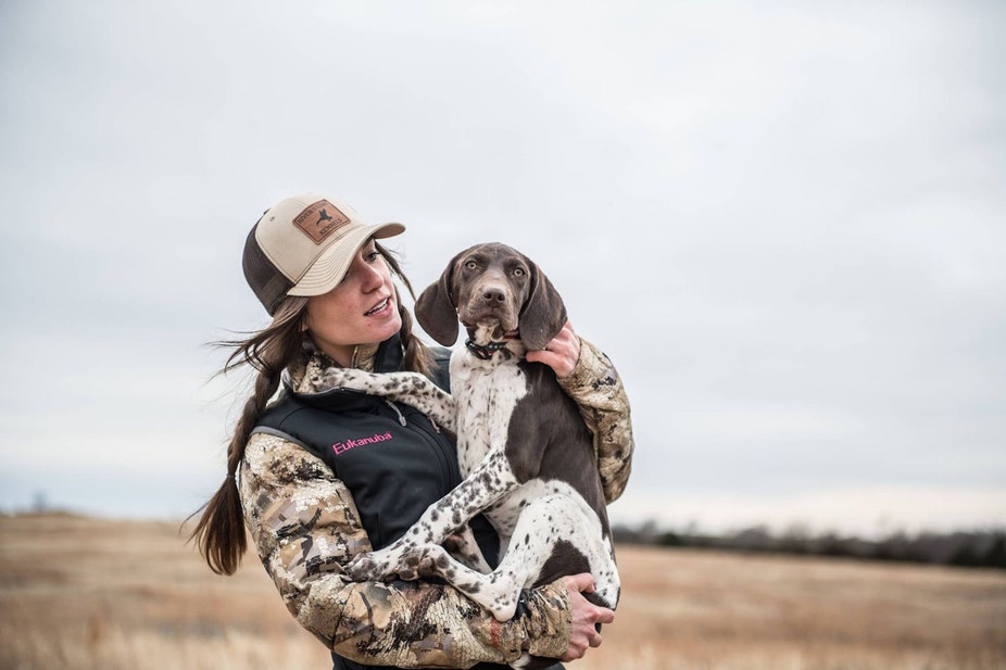 Whitney Miller creating a bond with a Shorthair puppy