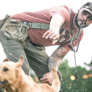 Barton Ramsey training a yellow Lab