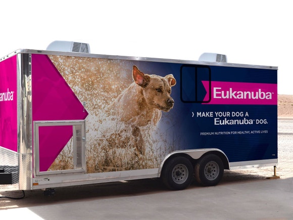 Eukanuba Research truck with image of a light brown dog running in water