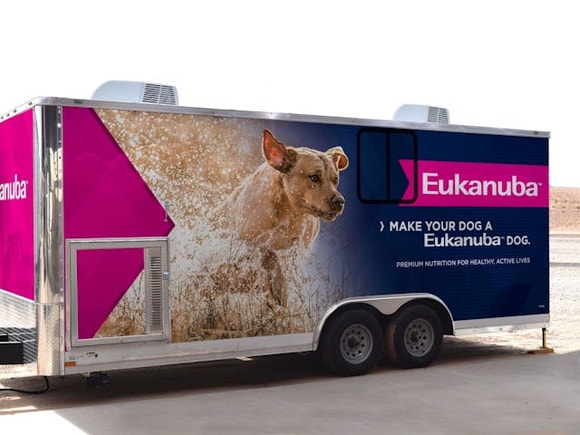 Eukanuba Research truck with image of a light brown dog running in water