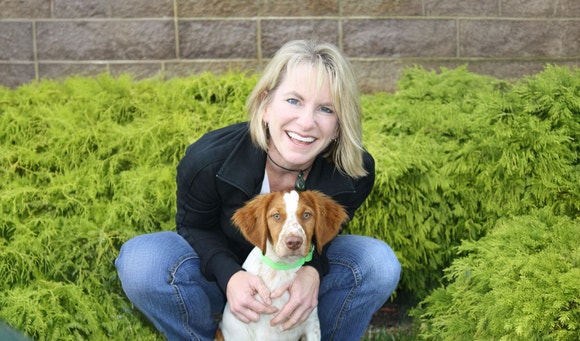 Doctor Jill Cline bonding with her Brittany Spaniel