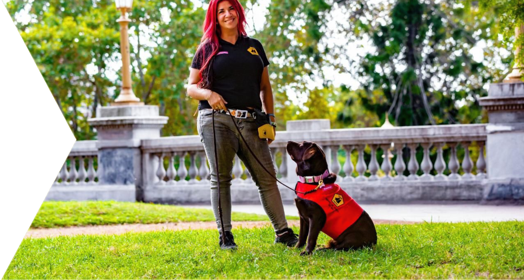 Woman holding dog on leash